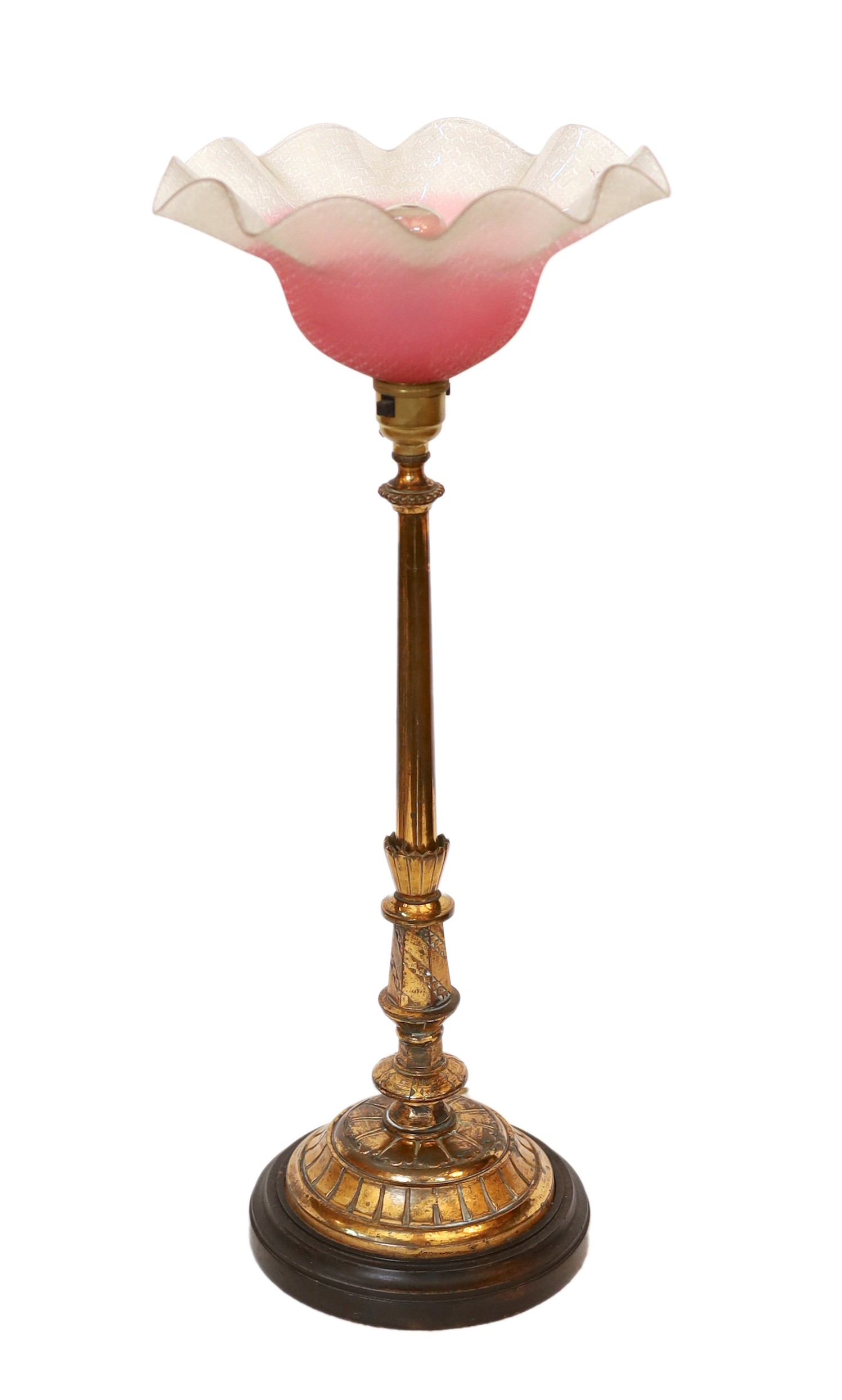 A late 19 century English lacquered bronze and glass table lamp with edged pink glass shade, height overall 51cm